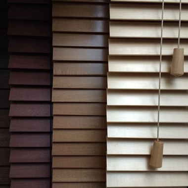 Different colors of wood blinds.